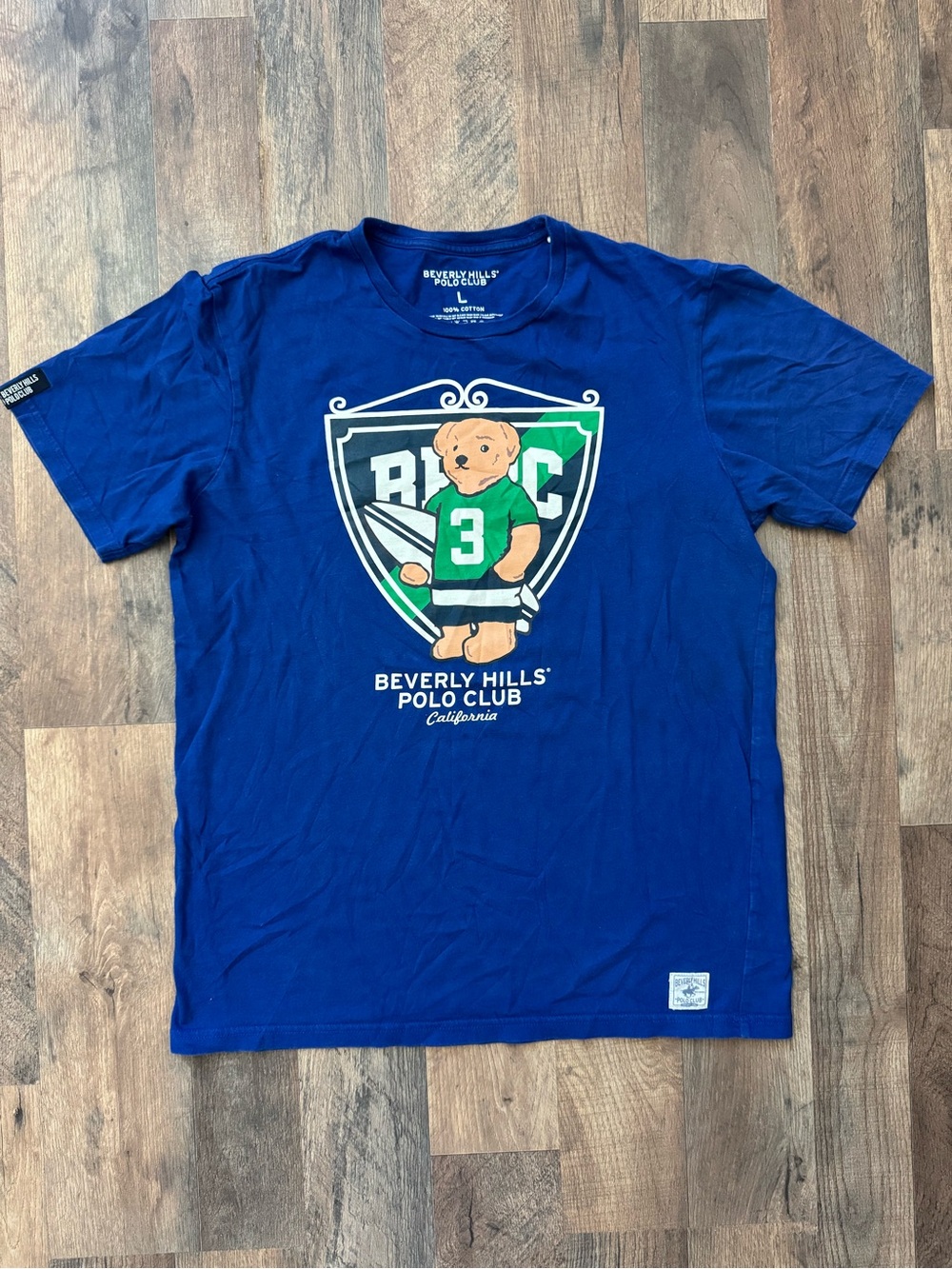 Beverly Hills Polo Club Men's Deep Blue Bear Graphic Tee with Green Accents
